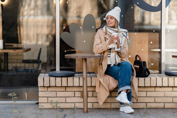 stylish woman walking in winter street