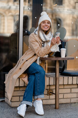 stylish woman walking in winter street