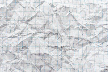 Texture of crumpled white paper in a cage, school notebook. White background