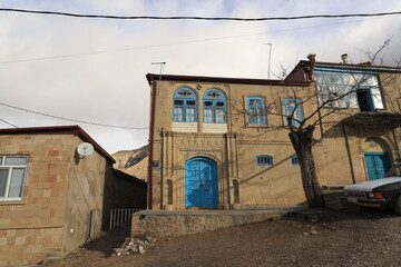 Bright elements in old houses in the mountain village of Chokh in Dagestan: walls, roofs, doors and window frames.