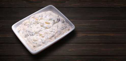 mushroom sauce with herbs and cheese, in a white saucer