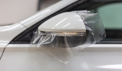 The process of installing PPF on the side mirror. PPF is a protective film for paint that protects...