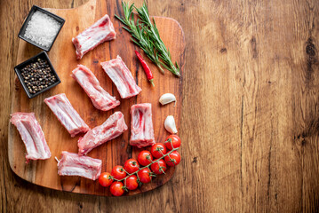 raw pork ribs on wooden background with copy space for your text