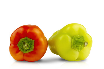 Two insulated peppers on a white background. Dietary food, veganism, healthy eating, red pepper, green pepper, isolate, lettuce, healthy vegetables.