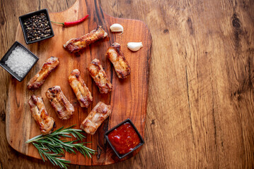 grilled pork ribs on wooden background 