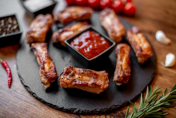 grilled pork ribs on wooden background 