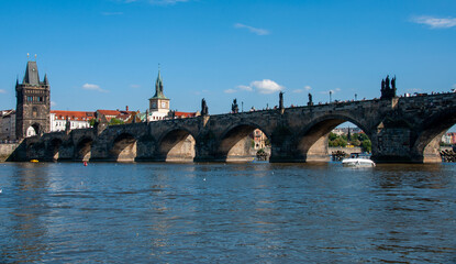 Fototapeta na wymiar Charles bridge on a sunny day during the summer in the city of Prague, Czech Republic