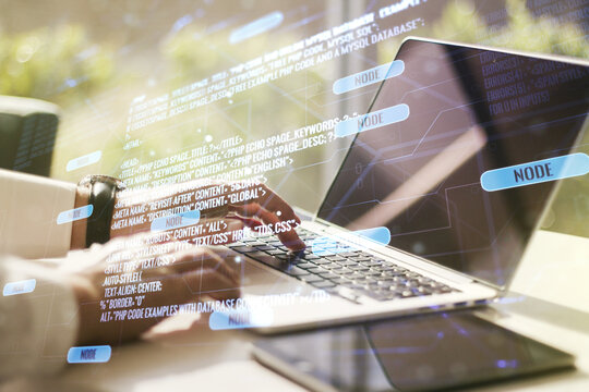 Multi exposure of abstract programming language hologram with hands typing on computer keyboard on background, artificial intelligence and machine learning concept