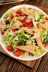A white tray with mixed salad