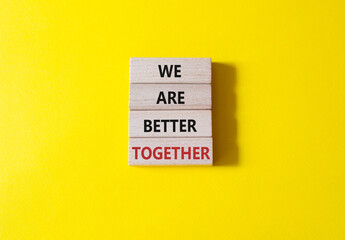 We are stronger together symbol. Wooden blocks with words We are stronger together. Beautiful yellow background. We are stronger together concept. Copy space. - obrazy, fototapety, plakaty