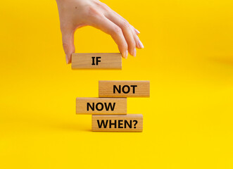 If not now when symbol. Concept words If not now when on wooden blocks. Beautiful yellow background. Businessman hand. Business and If not now when concept. Copy space.