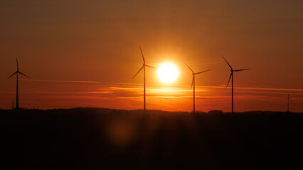 Fototapeta na wymiar wind turbine at sunrise