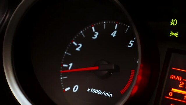 Tachometer of a modern car when the motor or engine work at single turns and the car does not move. Footage.Motion concept, close up video.
