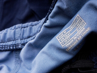 A label printed on a fitness pants showing the slogan Made in China
