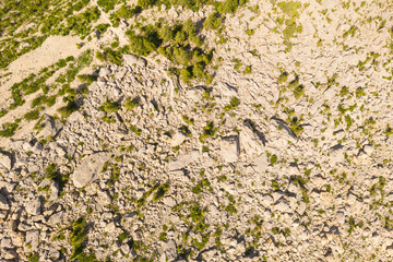 Drone pint of view of mountain rock slide and hiking path through it