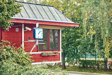 Security guard's house with cameras and clock in the private territory.