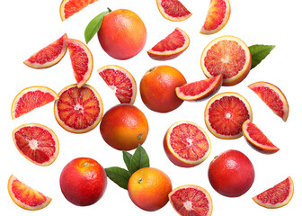 Many tasty Sicilian oranges and green leaves falling on white background