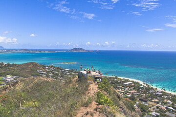 Hikers gather on the Lanikai Pillbox for views of the Pacific Ocean and windward side of Oahu, Hawaii