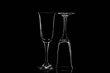 Glass glasses on a reflected glass table