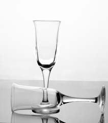 Glass glasses on a reflected glass table
