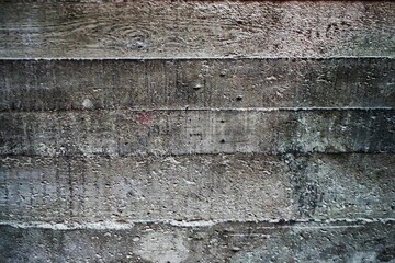 Grauweiße alte Betonwand mit Muster 