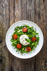 Mozzarella salad on wooden board
