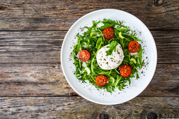 Mozzarella salad on wooden board
