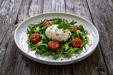 Mozzarella salad on wooden board

