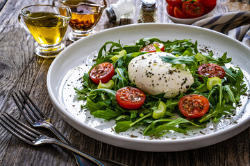 Mozzarella salad on wooden board
