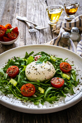 Mozzarella salad on wooden board

