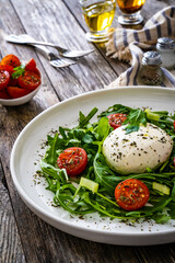 Mozzarella salad on wooden board
