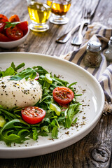 Mozzarella salad on wooden board
