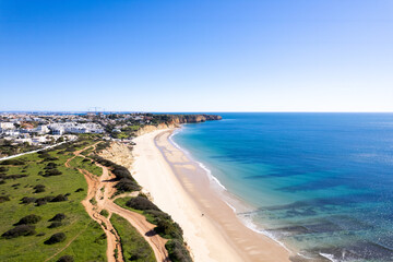 Fototapeta na wymiar Algarve Region Portugal. Lagos looking over to Praia Da Luz Beach. Beautiful Blue Skies