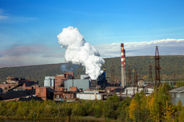 Fototapeta na wymiar Metallurgical plant. Environmental problem of environmental pollution. Emission of smoke Blast Furnace