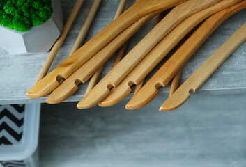 wooden hangers on a gray table