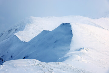 Mountains covered with snow in Parang National Park, Romania, Europe