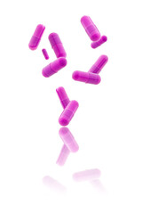 pink medical gel capsules falling down on white background. food supplement, pharmacy concept. plastick capsules pills