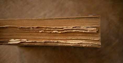 Yellowed pages of an old book. Restoration of books and magazines. Vintage literature.