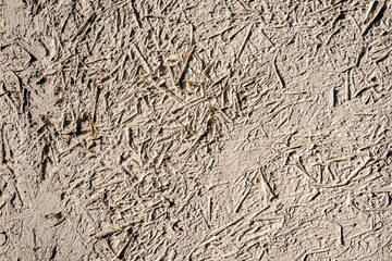 Stone wall texture/The white walls are made of mortar mixed with hay and rice straw.