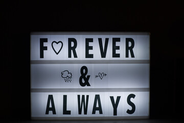 Forever and Always Quote on a Display frame.