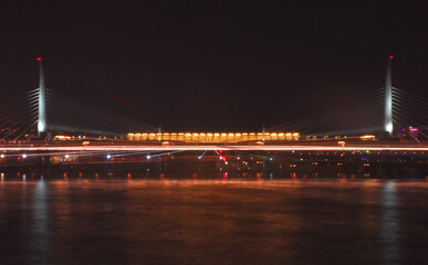 Istanbul Golden Horn Metro Bridge at night with the lights of the city