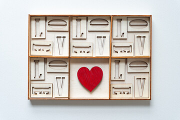 wood heart, shallow box, and letters l, o, v, and e