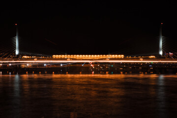 Fototapeta premium Istanbul Golden Horn Metro Bridge at night with the lights of the city. Also known as Ataturk Bridge