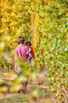 Mother and daughter near the river in autumn Escabas. Ca&Atilde;&plusmn;amares, Strait of Priego, Castilla la Mancha, Spain
