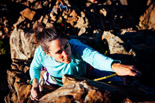 A woman rock climbing in Utahs Uinta Mountains.