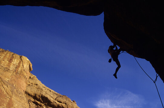 Rock climber at Smith Rock State Park, Oregon, USA