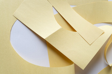 pale yellow construction paper cut and folded on blank paper