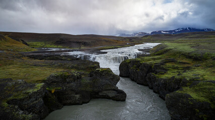 Iceland Highland Waterfall in Autumn, Drone Photo, Overcast, Mountain range in background