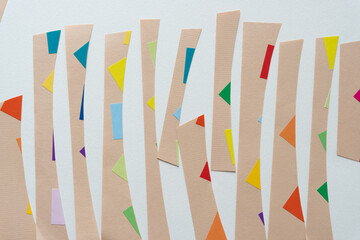 brown paper stripes with edges of colorful stickers