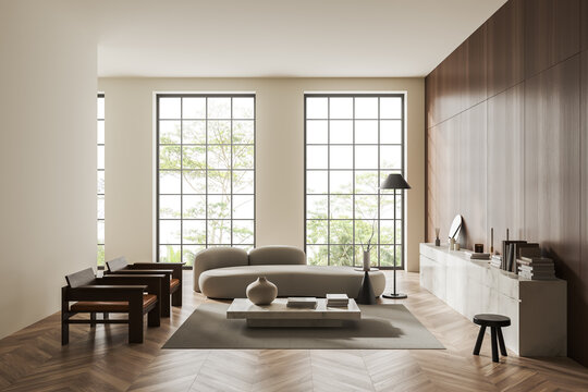Light relaxing interior with couch, armchairs and panoramic window